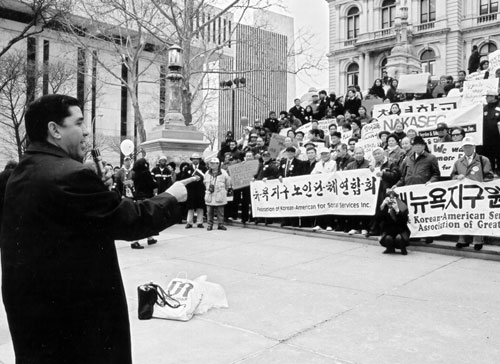 Adriano Espaillat, Task Force Chair, addresses the participants of Immigration Day on the steps of the state Capitol.