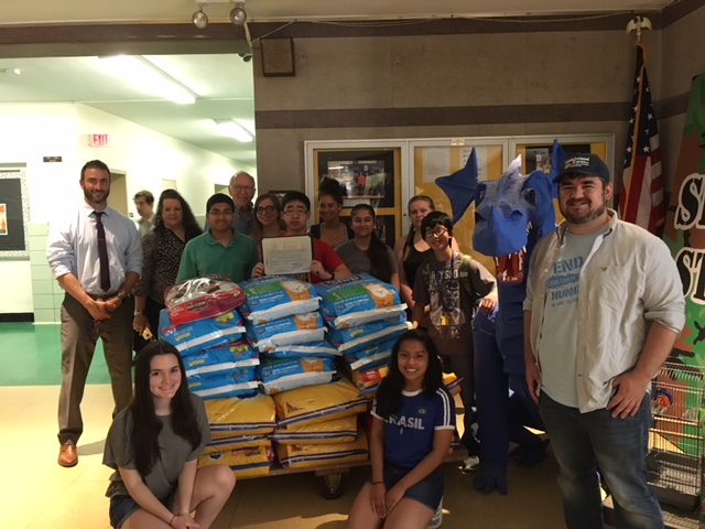 Assemblyman Dave McDonough [center back] joins members of Division Avenue High School's Key Club, Club Advisor Joann Medina, Principal John Coscia and William Gonyou of Long Island Cares Inc. and