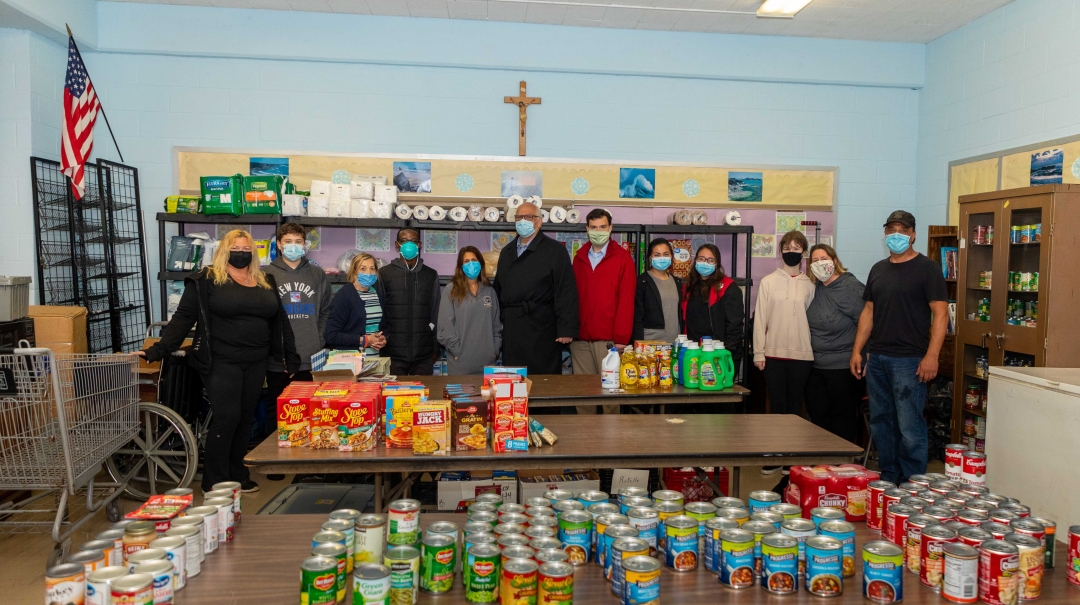 Assemblyman John Mikulin (R,C,I-Bethpage) with (from left to right) Mary Klockler, Liam Klockler, Diane Sabino, Fr. Francis, Lisa Savallo, Town of Hempstead Councilman Dennis Dunne, Mikulin, Emma Roch