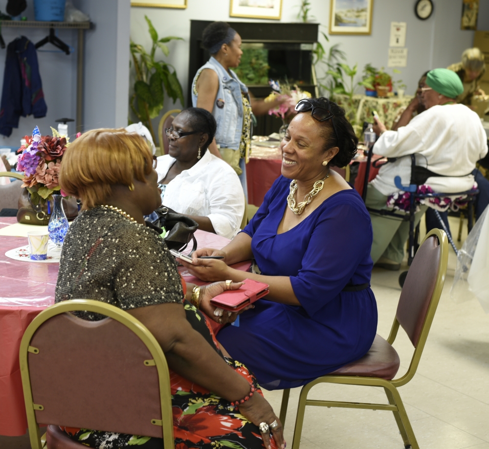 Assemblywoman Hyndman catching up with seniors at local center.