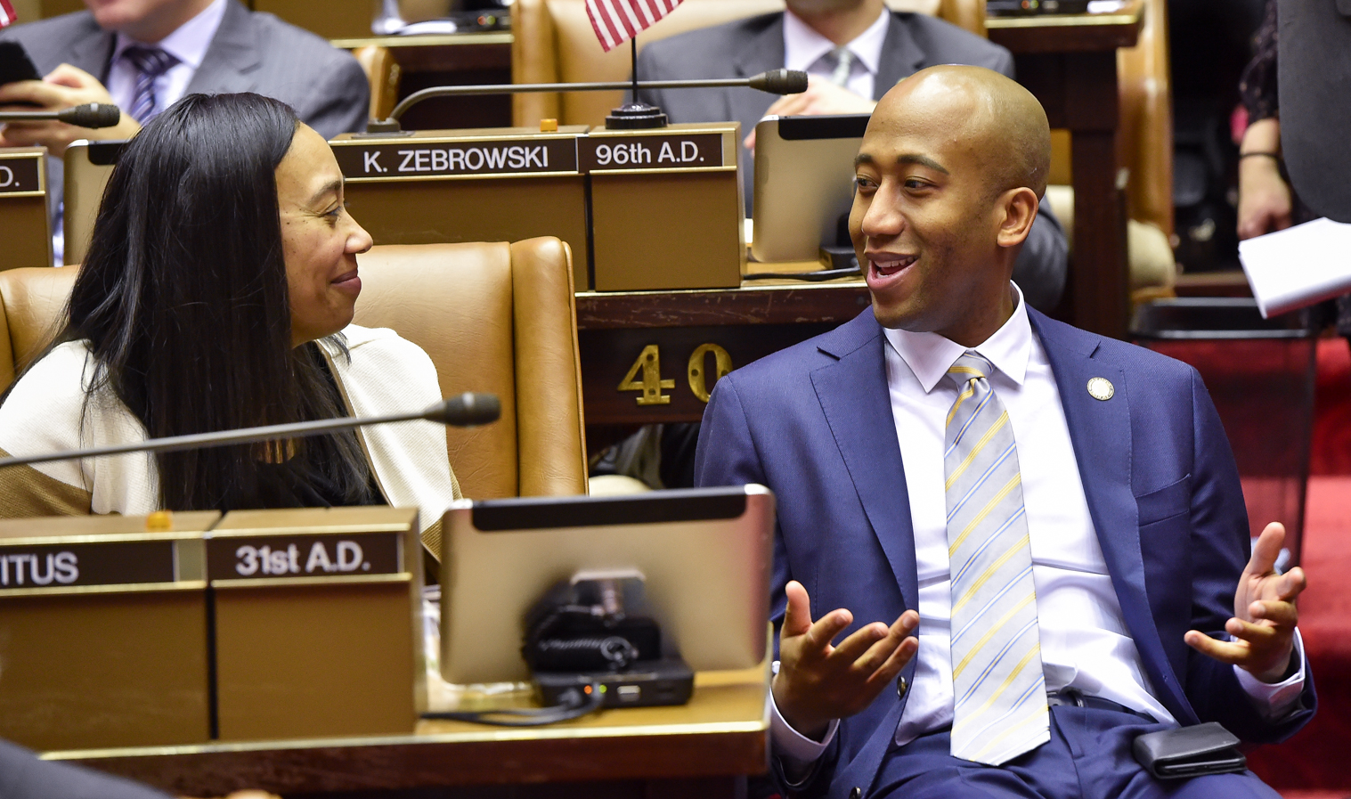 Assembly member Vanel Speaking with Assemblywomen Michele Titus.