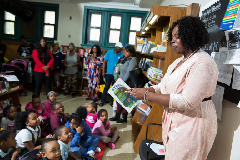 Assemblywoman Walker reading with the kindergartners, first and second graders at the library.