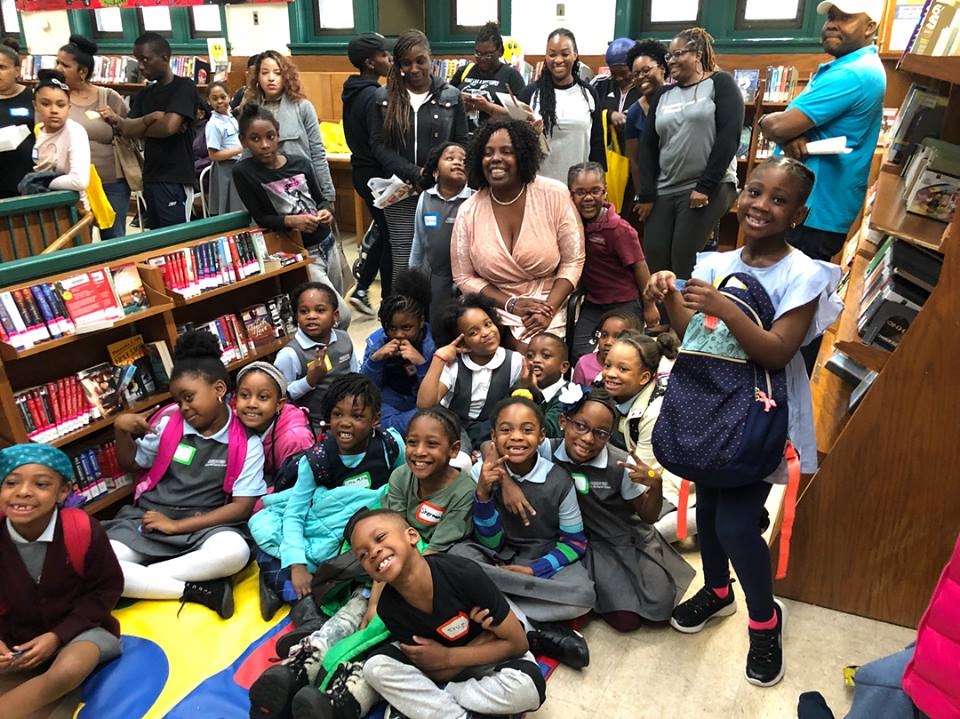 Assemblywoman Walker reading with the kindergartners, first and second graders at the library.