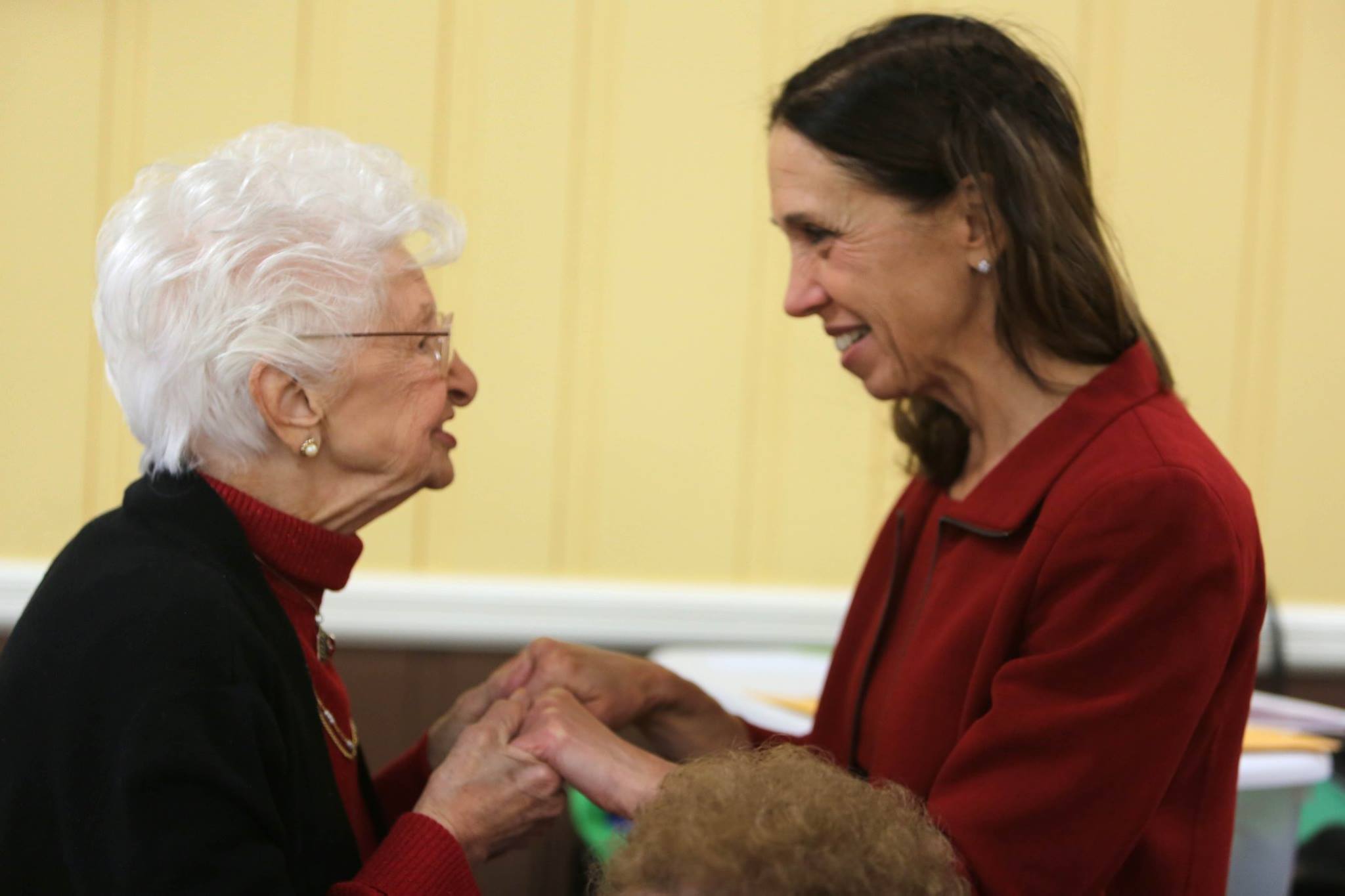 Assemblywoman Amy Paulin interacting with a Tuckahoe senior while giving out holiday cookies.