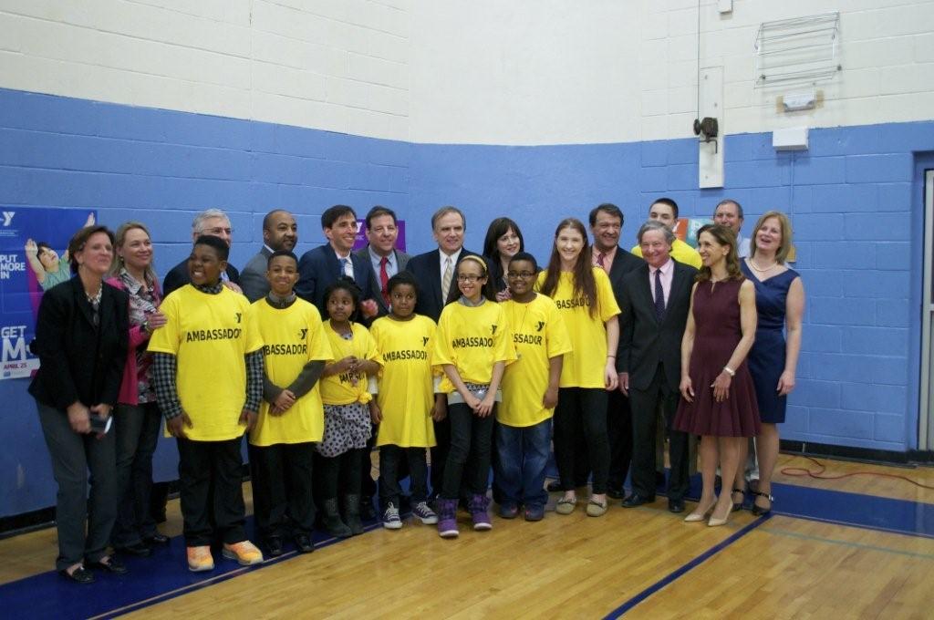 Assemblymember Otis meets with student ambassadors at an event in support of the New Rochelle YMCA.