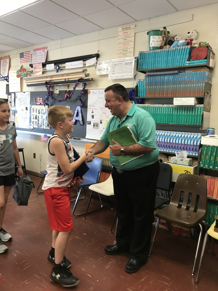 Assemblyman Karl Brabenec [front] listens to public policy ideas from students at Minisink Valley Intermediate School Friday