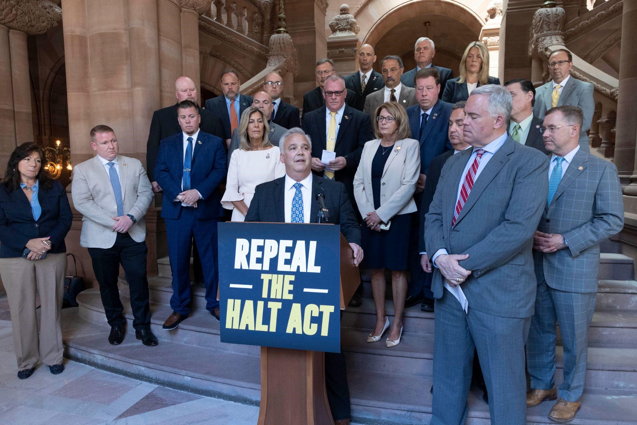 Assemblyman Chris Tague (R,C,I-Schoharie) joins Assemblyman Matt Simpson (R,C,I-Horicon) and other Minority lawmakers and officials from the New York State Correction Officers Police Benevolent Associ