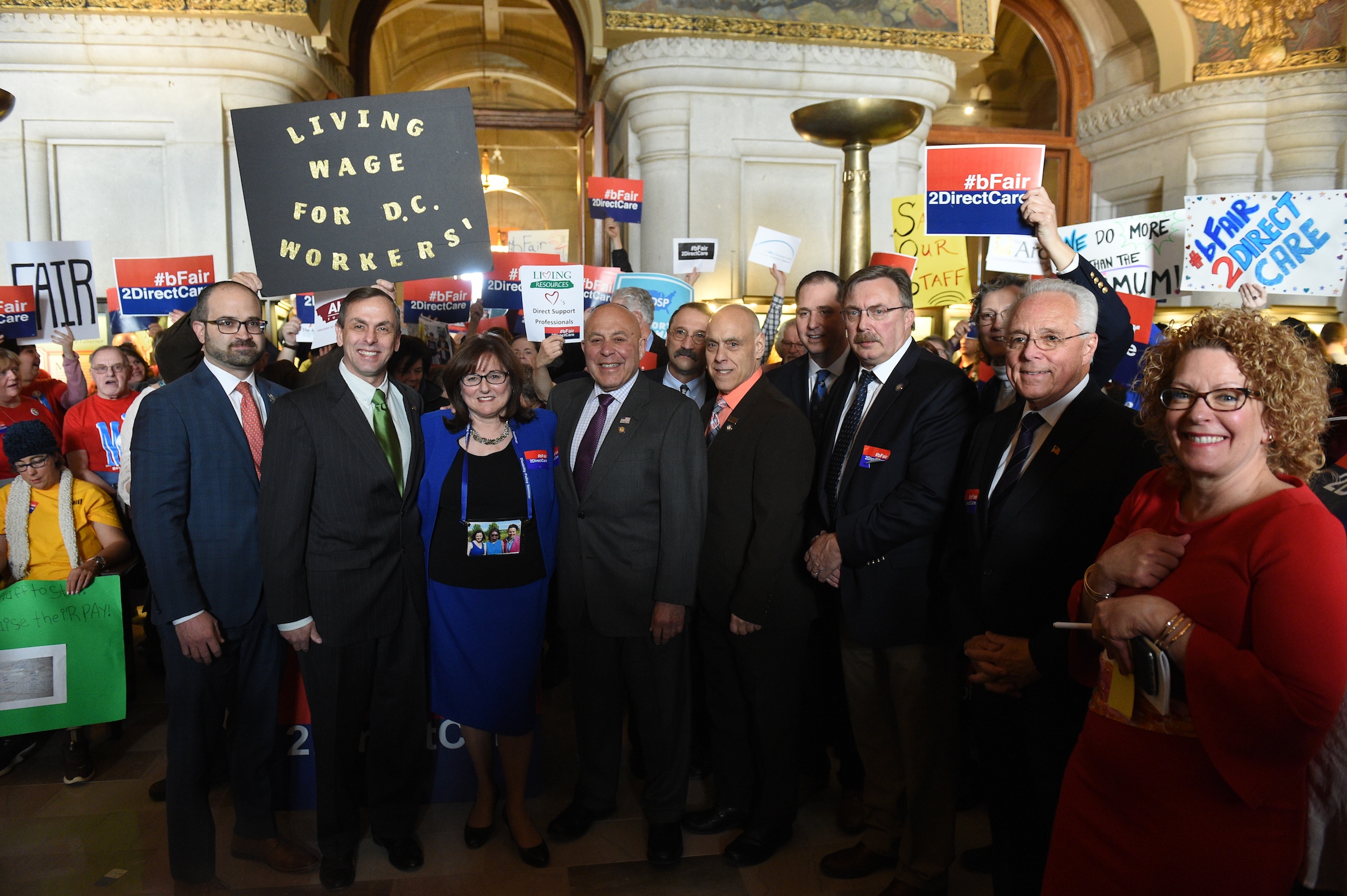 Assemblyman Brian Miller (third from right) rallies with Assembly members and direct care advocates at the state Capitol on March 25, 2019.